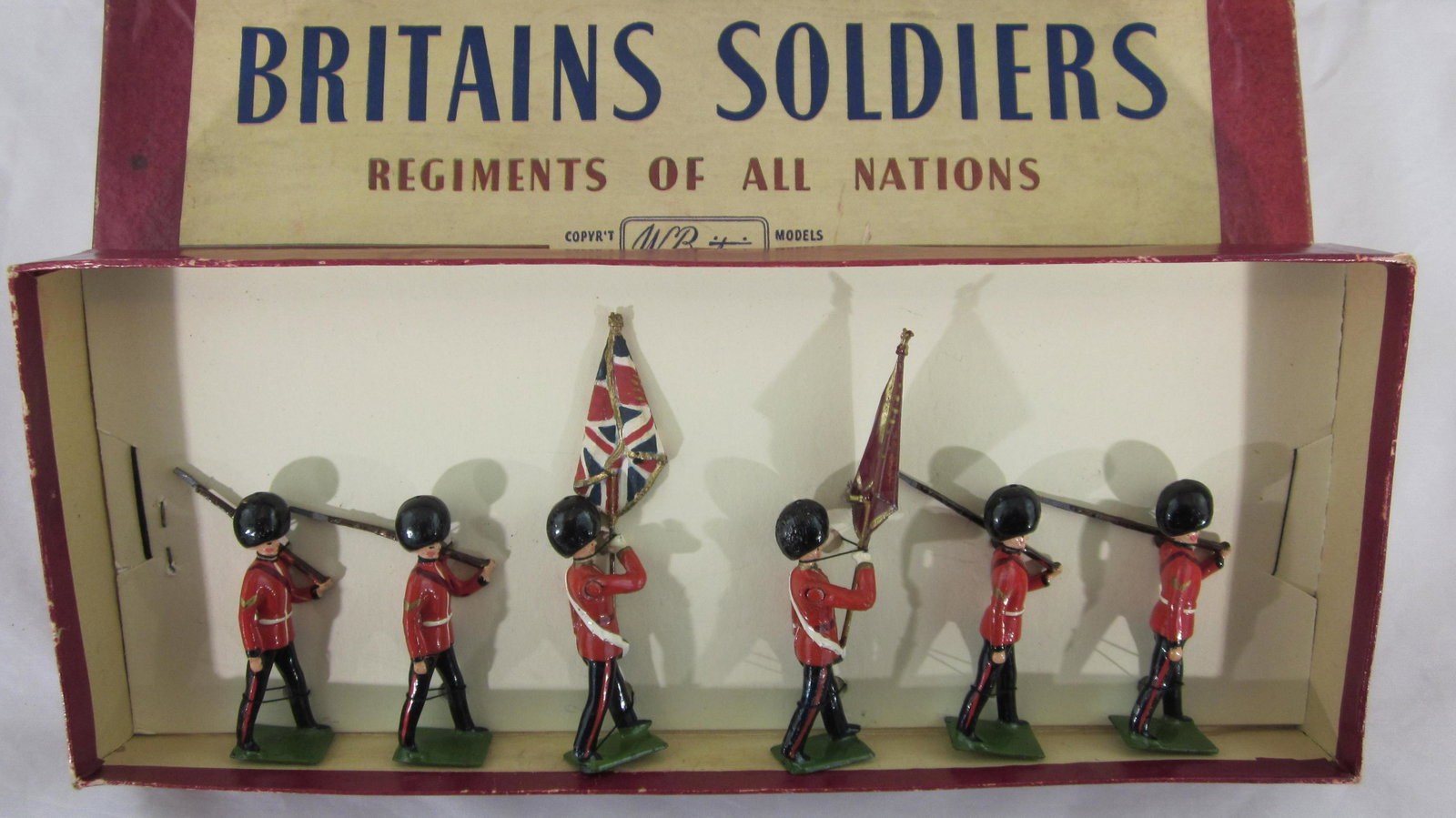 Britains Set #2084 Scots Guard Color Party.: Boxed Scots Guard Color Party, cast flags only offered 1955-1959. 6 pieces, condition mint in very good ROAN box, lid has scuffed edges.