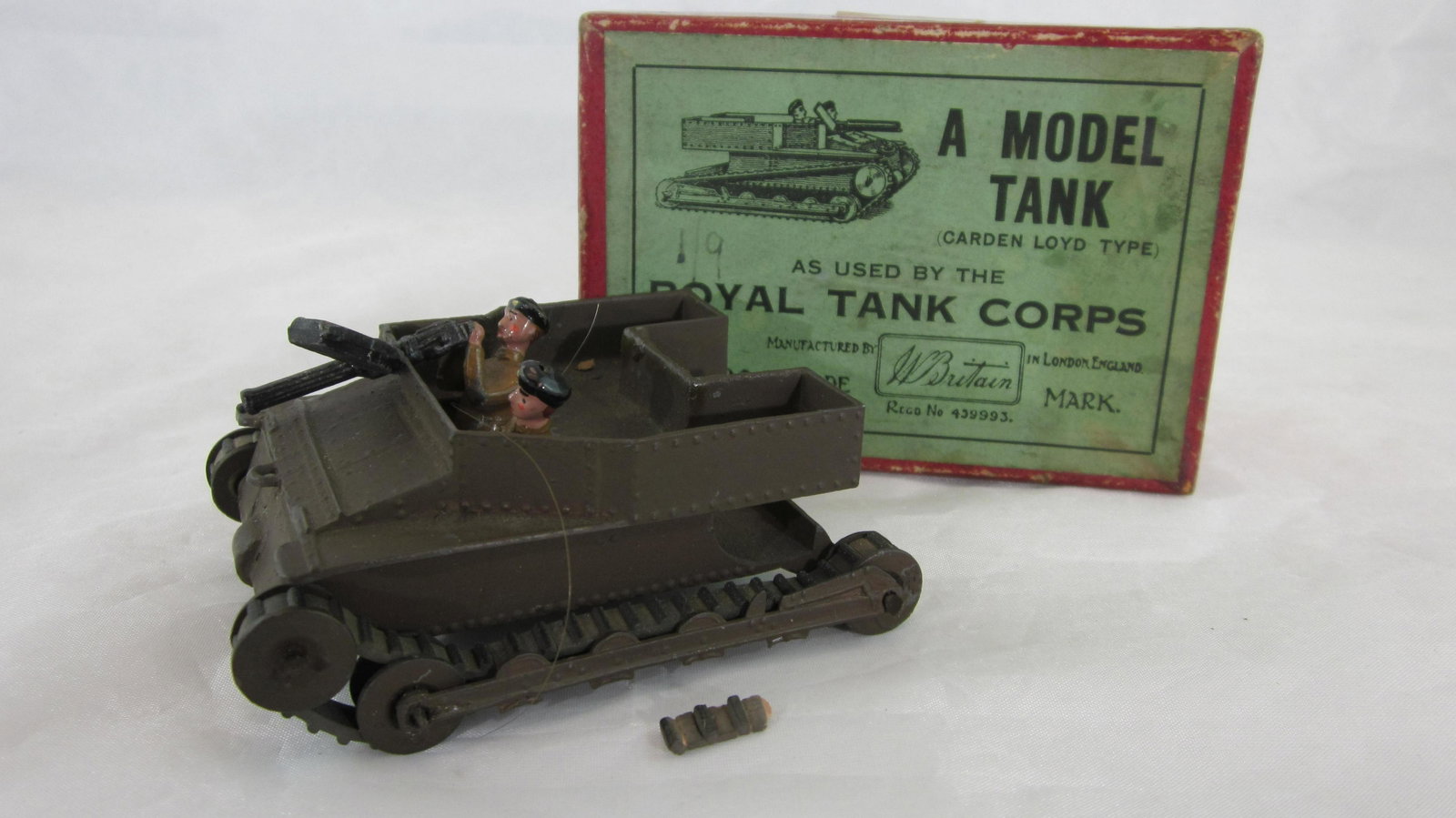 Britains Set #1203 Carden Lloyd Tank With Crew.: Post War. Boxed 1st version Carden Lloyd Tank with rubber treads. 4 pieces including machine gun. Condition very good, treads perishing but present ( 1 small piece of tread detached), gun ammo magazin