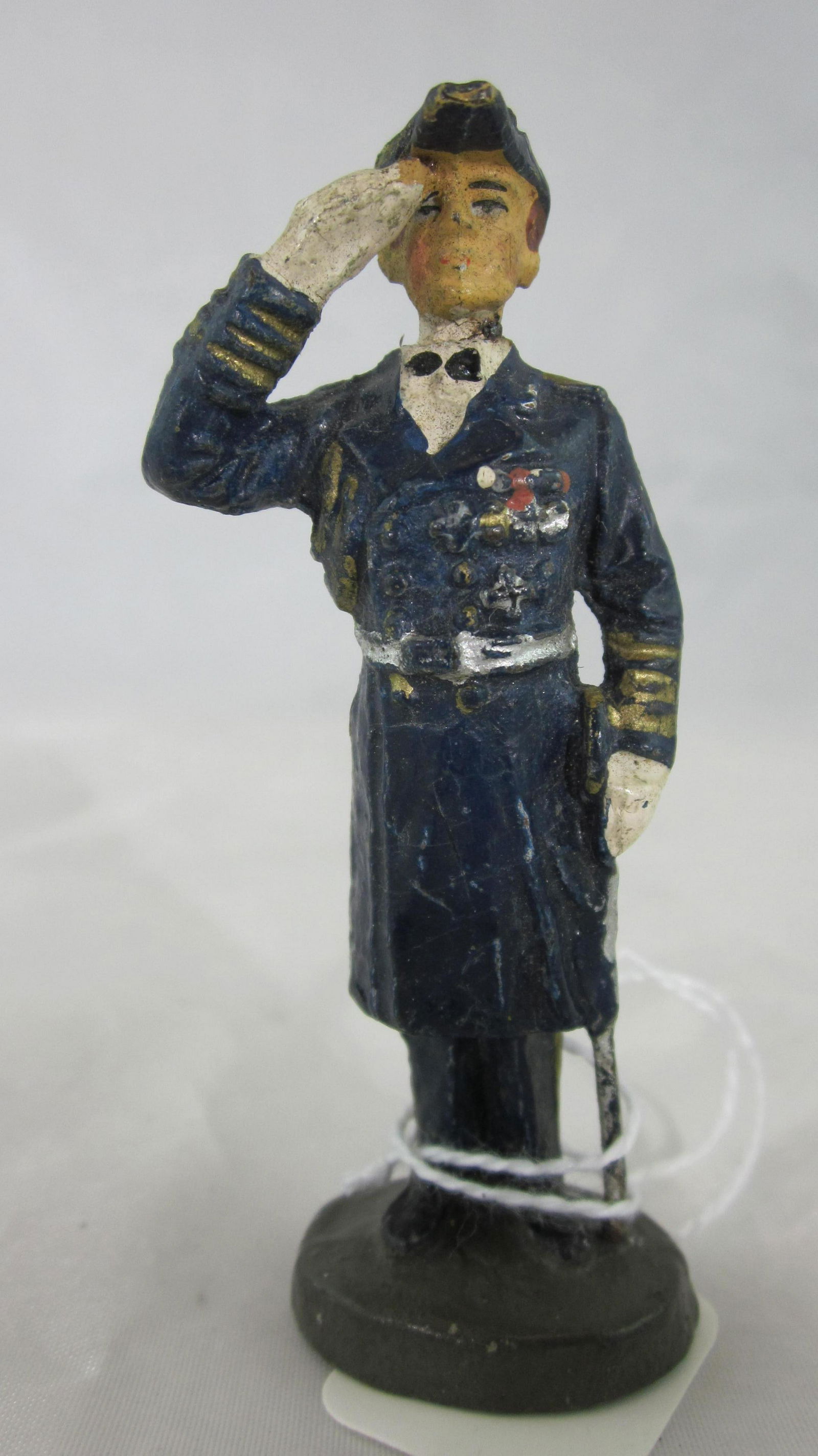Elastolin Admiral Raeder In Naval Uniform.: UNBOXED 7cm Admiral Raeder, fixed arm figure circa 1930s. 1 piece, condition very good, small chip on heel, rear tip of bicorn hat is missing. Paint is very good. See page 101 in Polaine Elastolin boo
