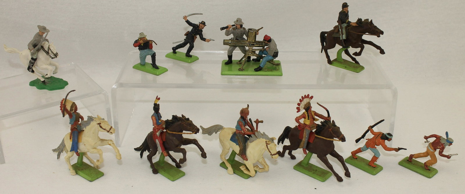 Britains Indians and Confederate Gatling Gun: Deetail Series. Lot includes North American Indians, Gatling Gun with Confederate Troops. 11 Pieces. Condition Fair to Good. Dusty From Storage. Some Paint Loss. Some Weapons Bent. No Box.