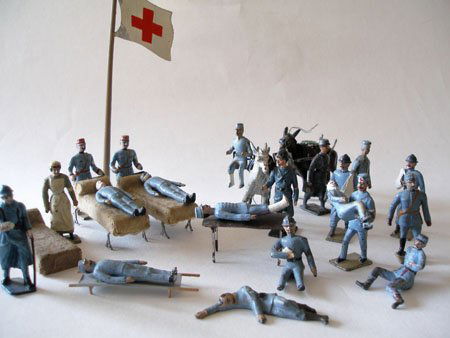 Mignot Medical grouping. RARE Early Pre War: Mignot Medical grouping. RARE Early Pre War, Possibly Lucotte transitional pieces. Light Blue uniformed French troops from WW1 including wounded on Mules, Orderly carrying wounded, Medical Officers, O