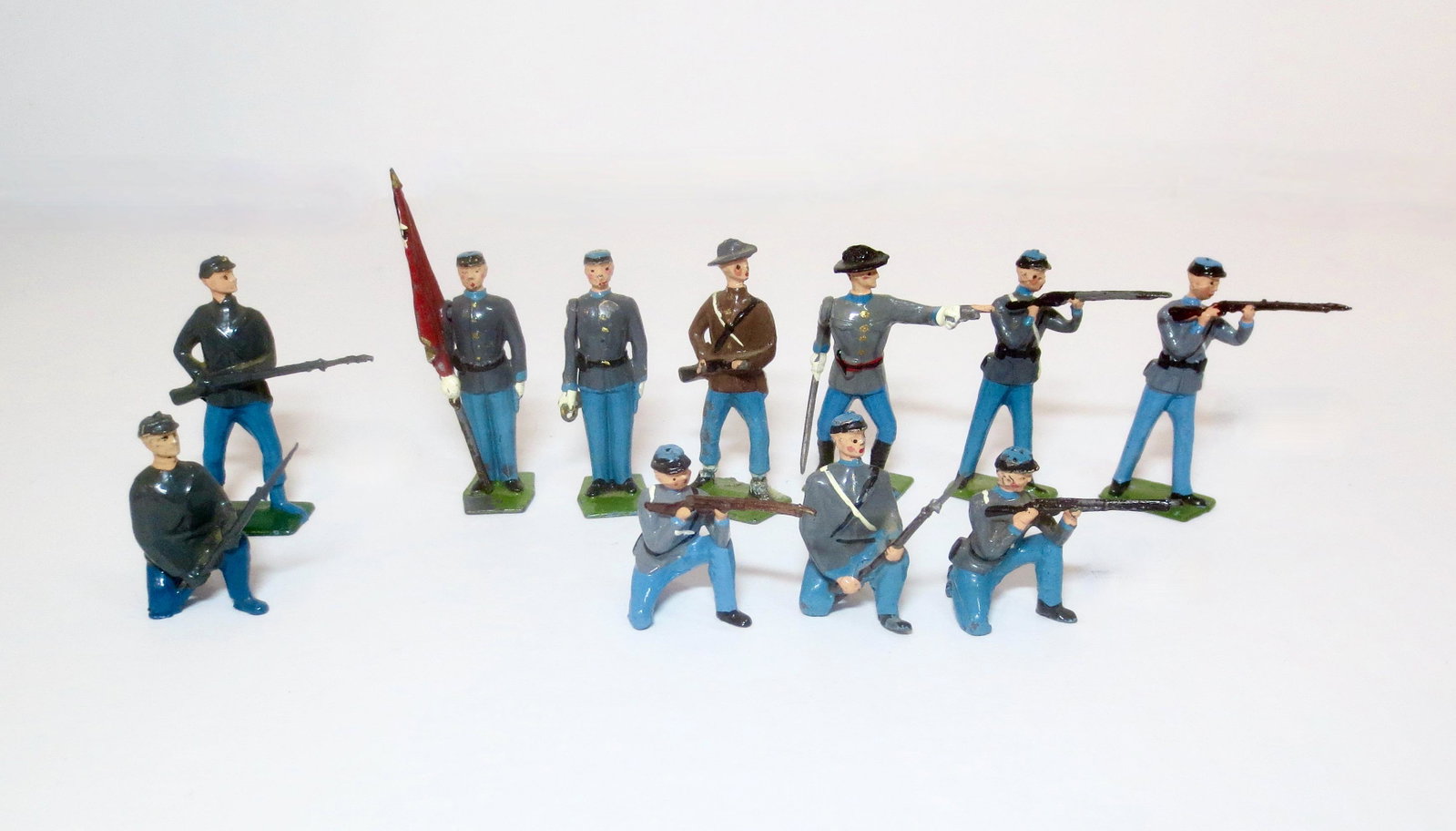 Britains ACW Confederate Army Figures: From set #2060, plus two second grade figures. 11 pieces. Excellent overall condition (one broken rifle). Unboxed.