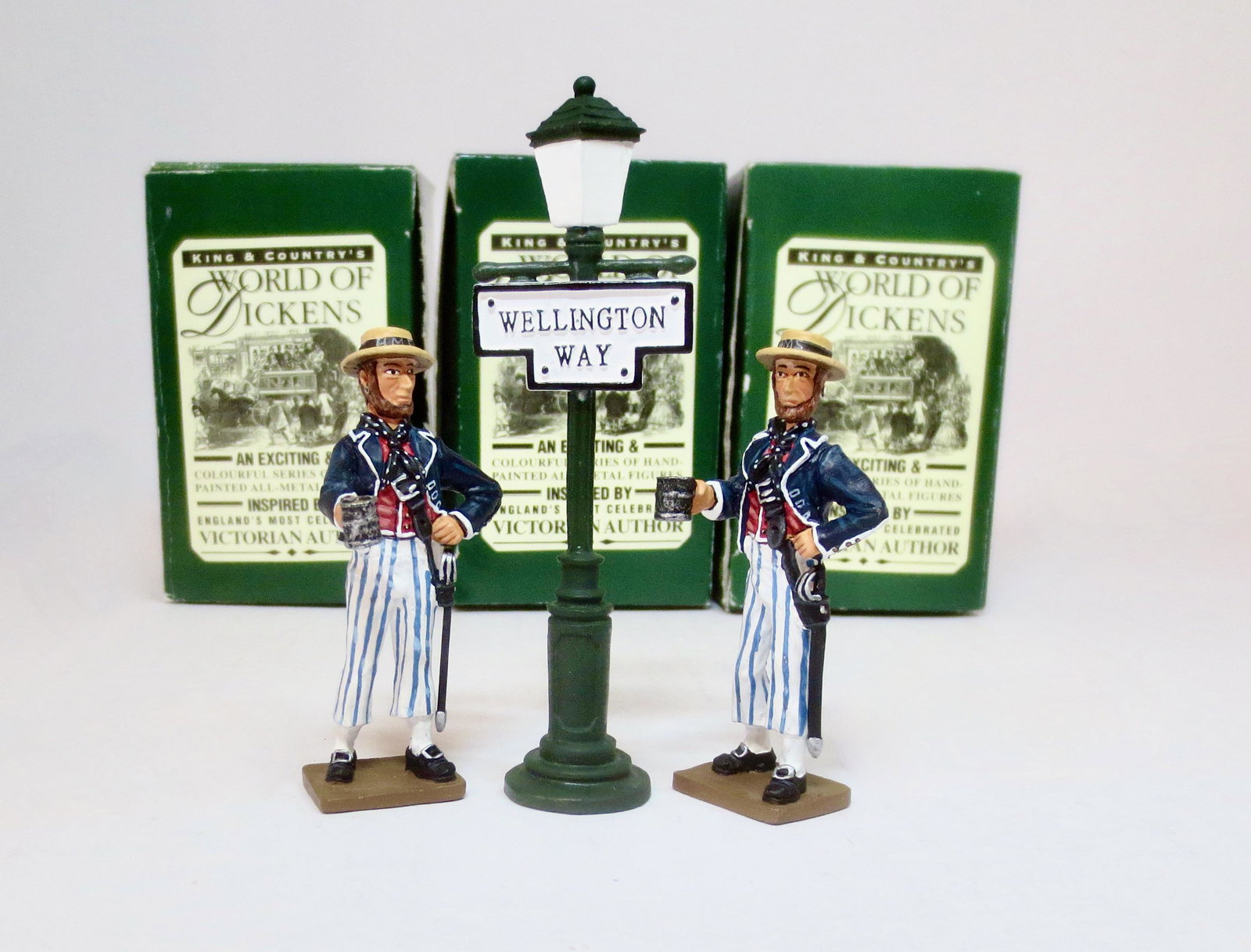 King & Country "The World of Dickens": Two #D041 "Jolly Jack Tar" figures with #D007 Wellington Way Lamp Post. Retired. 3 pieces. Mint condition. Boxes very good.
