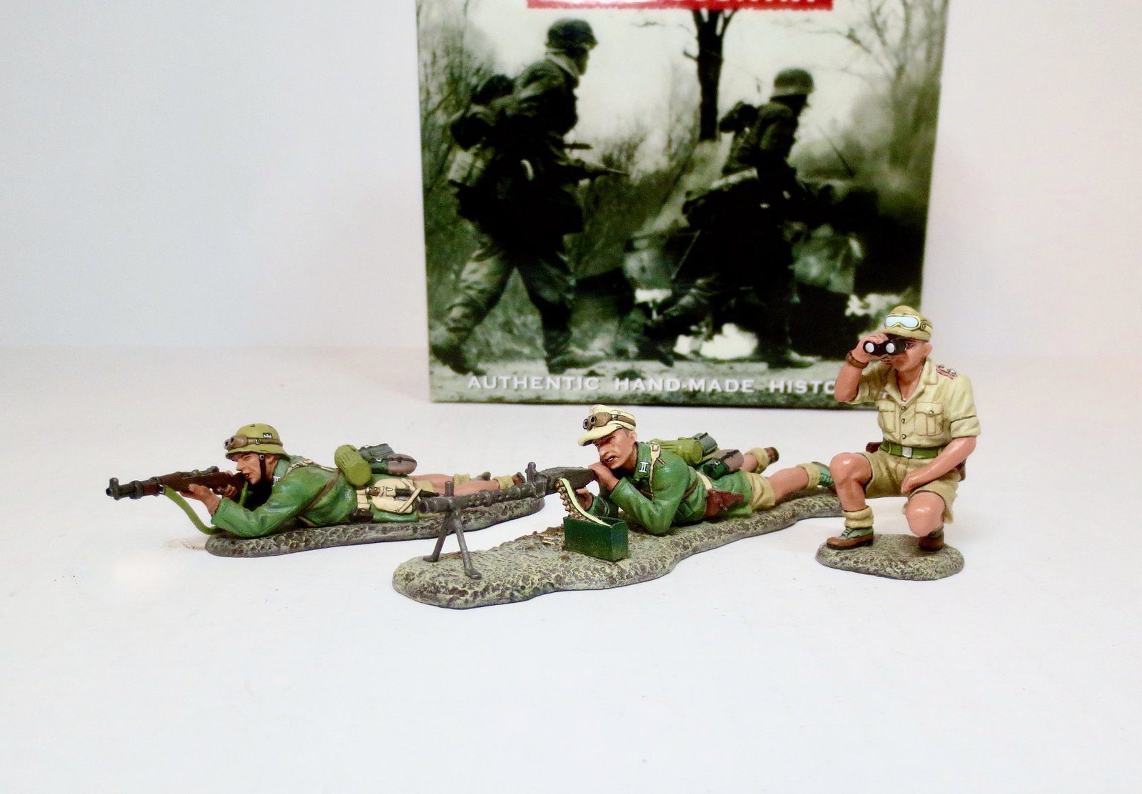 King & Country #AK055 "New Machine Gun Crew”: Retired set. Watched over by a kneeling NCO this MG34 gunner and a rifleman put down some “heavy fire” on the enemy. 3 pieces. Mint condition. Box excellent.