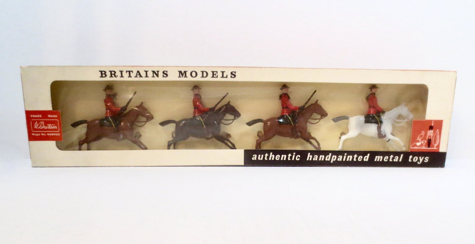 Britains #9256 Royal Canadian Mounted Police: Post war issue. 4 pieces. Mint condition, tied to card In original cellophane fronted box. Box very good, cellophane beginning to come loose.