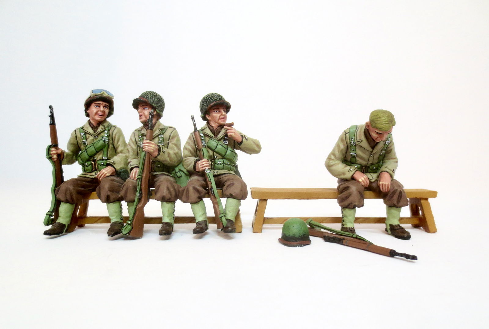 King & Country #DD040 "Truck Passengers": Retired set. 2 pieces (three sit together, and one battle weary sits alone. Bench not included). Mint condition. Box excellent.