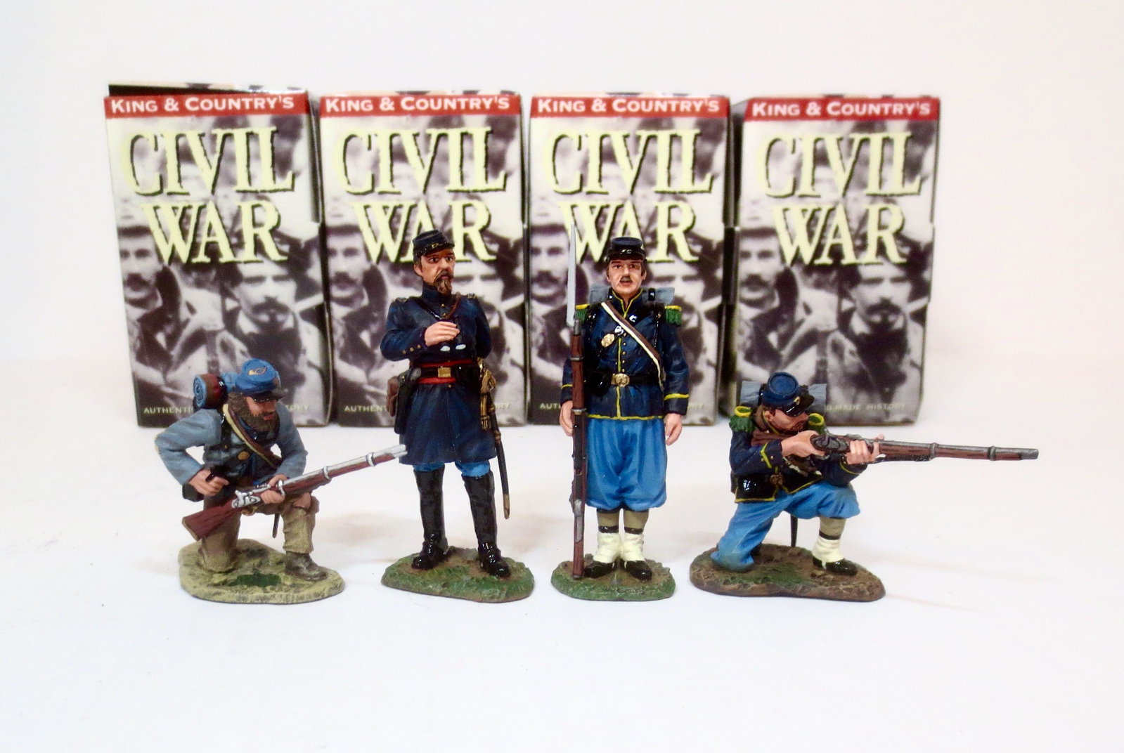 King & Country American Civil War Figures: Confederate firing rifle with Union Infantry men #CW024, #CW026, #CW027, and #CW028. 4 pieces. Mint condition. Boxes excellent.