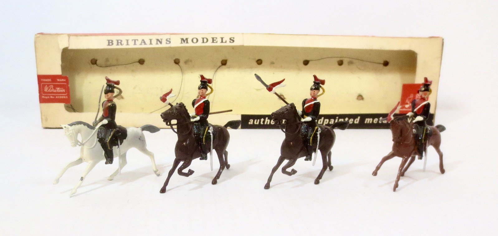 Britains #9217 The 12th Royal Lancers: Post war issue. 4 pieces. One missing lance tip, the rest in excellent condition. Box in poor condition.