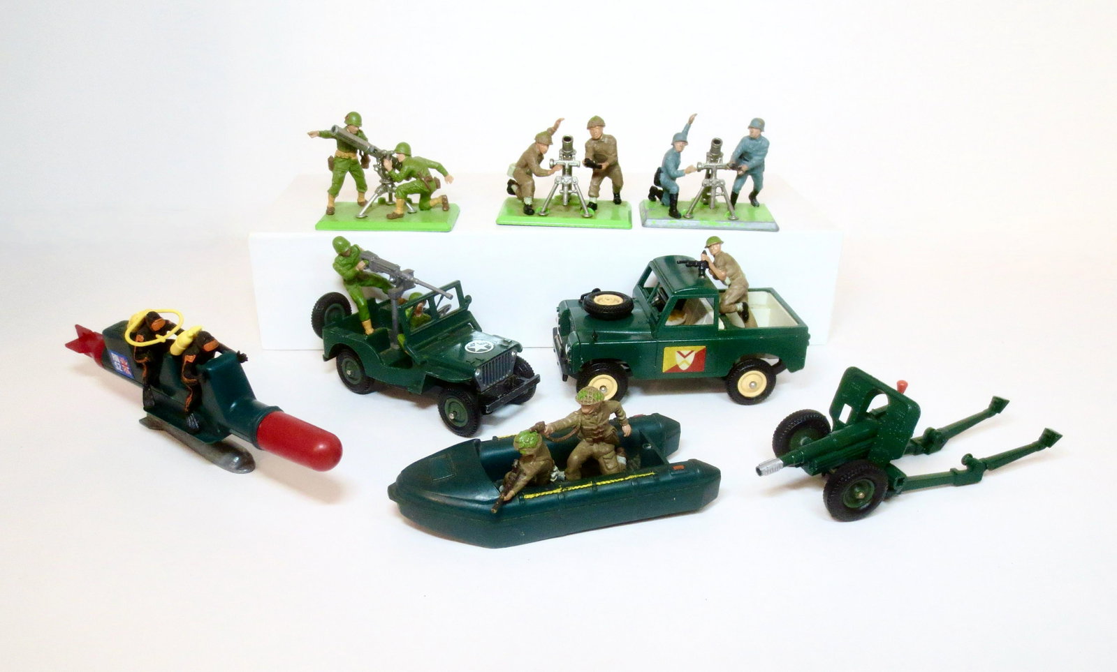 Britains Deetail Military Assortment: Includes 7.5mm Gun with Crew, Two Mortars with Crews, British Truck with Machine Gunner, U.S. Jeep with Driver & Gunner, Pontoon with Crew, Scuba Team on Submarine, and Field Artillery Gun. 8 pieces. 
