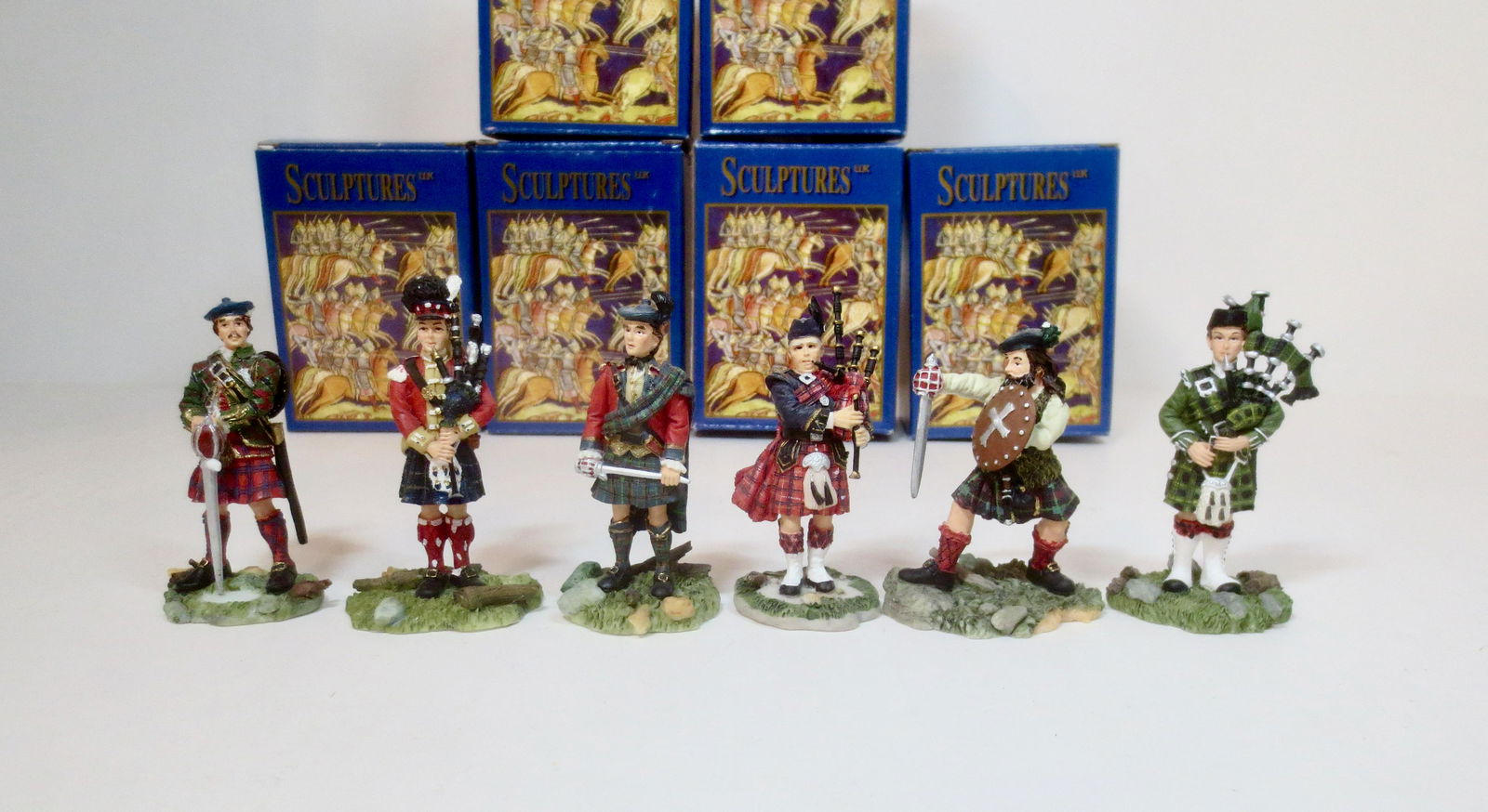 Sculptures Assorted Highlanders: Hand painted porcelain figures. 70mm tall. 6 pieces. Excellent condition. Boxes very good.