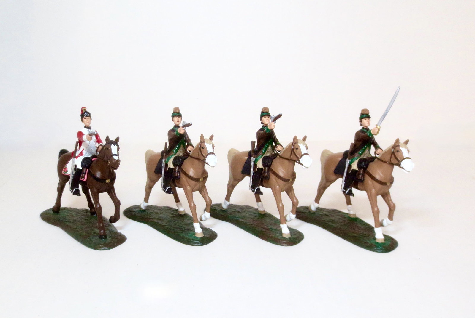 Lemans U.S. Light Horse & British Dragoon: Harry Lee with Sword Raised and two United States American Dragoons with Pistols raised, plus one British Dragoon with Pistol Raised. Studio painted, signed Lemans on the base bottoms. 4 pieces, Mint 