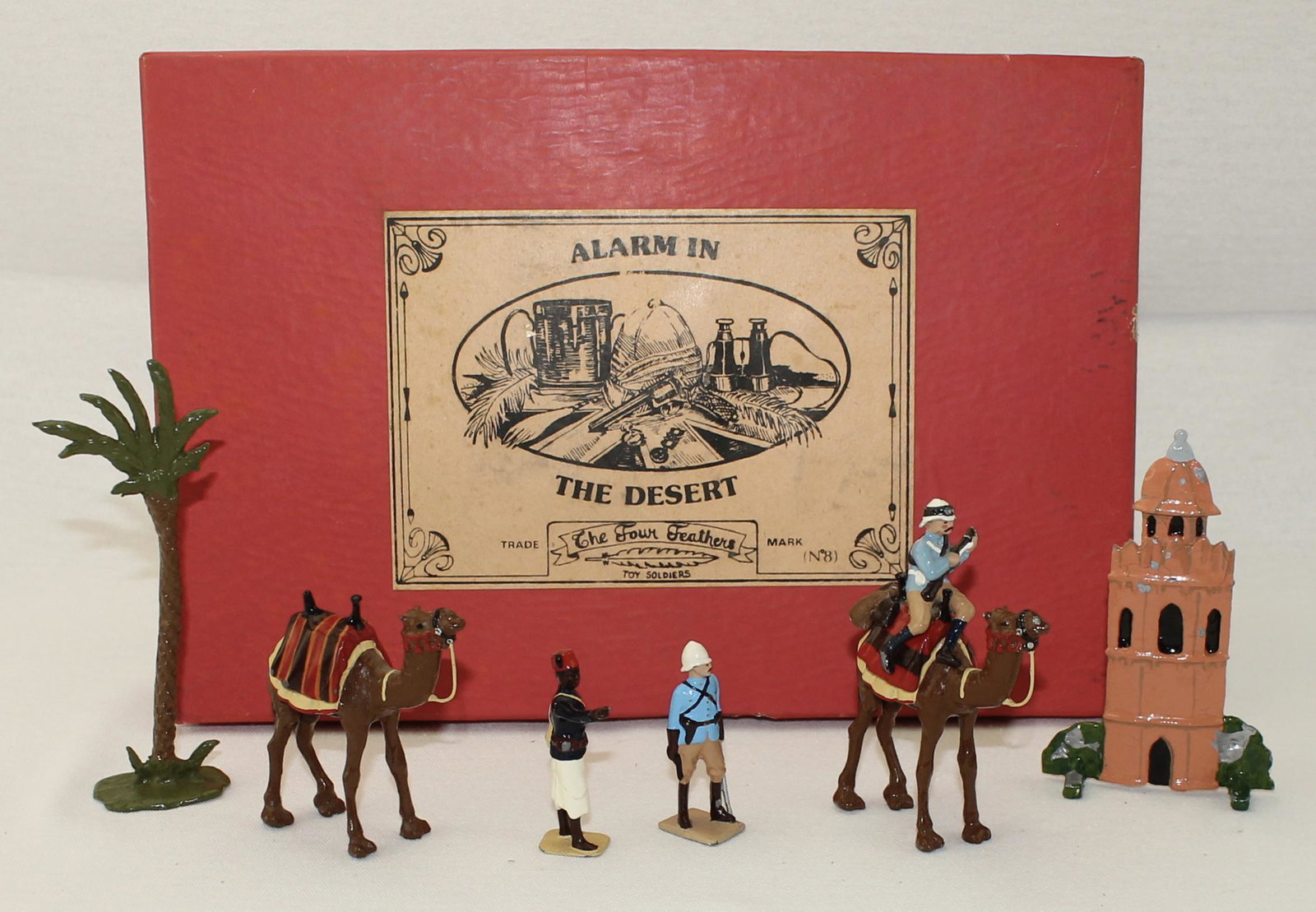 Four Feathers Set #8 Alarm in the Desert: Alarm in the Desert. Two Scenic Elements from another set Included. 7 Pieces. Condition Good to Very Good. Lacking Some Original Scenic Elements. Camel Rider's Rifle Broken. Paint Chips on Building. B