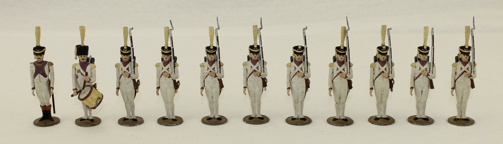 Metayer Lot 33rd Infantry at Attention: Madame Metayer of Paris. 33rd Infantry at Attention. Lot includes Officer, Drummer and 9 Troops. 11 Pieces. Condition Good to Very Good. 4 Bayonets Missing. One Plume Missing. 2 Swords Missing. One Sw