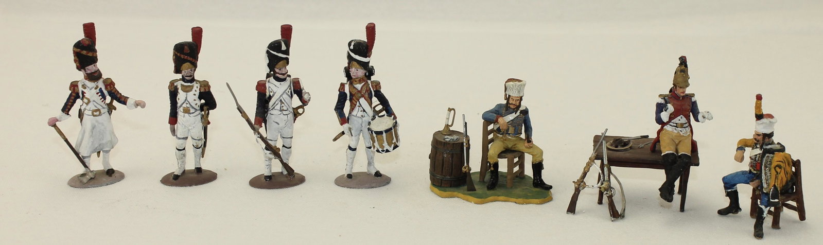 Lot Napoleonic Infantry and Vignette: Napoleonic Infantry and Vignette. Lot includes 4 French Napoleonic Line Infantry by Tradition Castings and a 5 Piece Vignette Depicting Napoleonic Officer at Table with Seated Officers by Andrea Casti