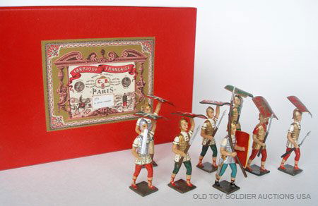 Mignot Set # 573 Romans: Mignot Set # 573 Romans with Shields held above head and Centurion. Post War. 8 Pieces in Original Drop Down Fronted Display Box.