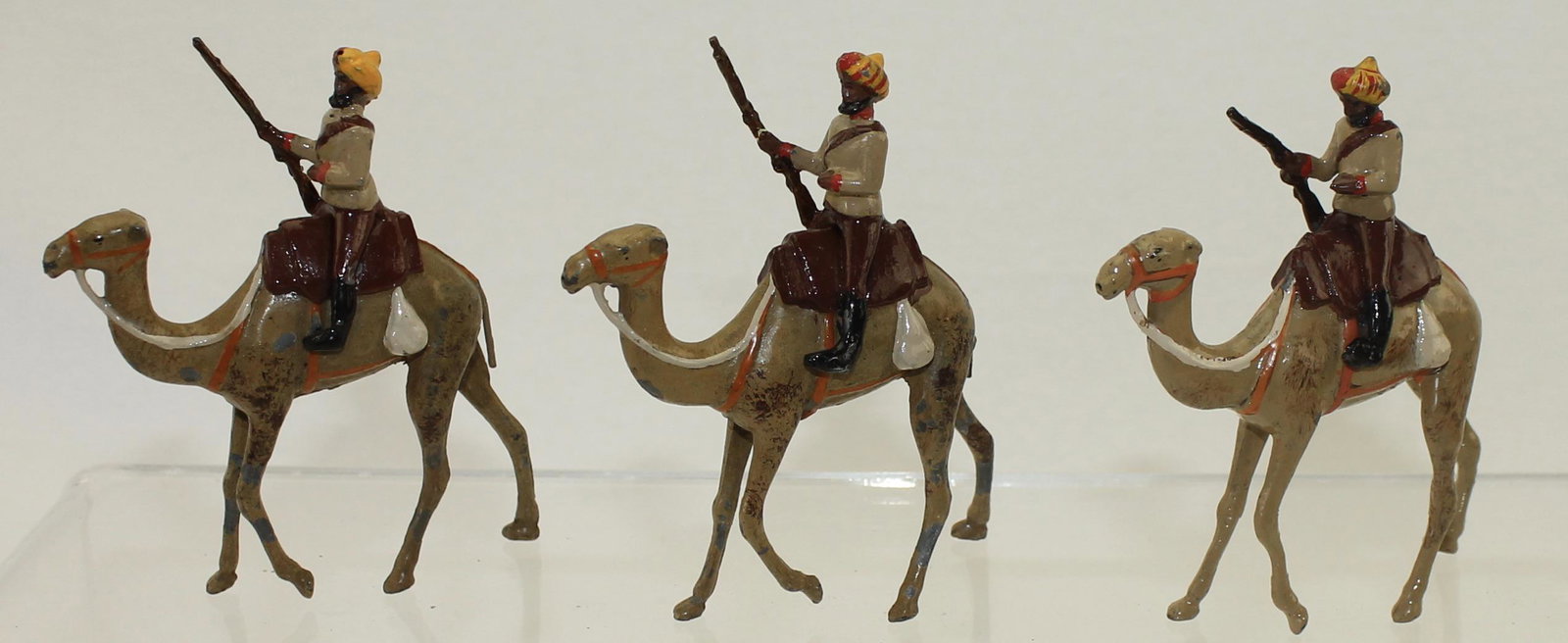 Britains Set Bikanir Camel Corps: Set 123.Bikanir Camel Corps. Circa 1920. Figures Soldered to Camels. Wire Tails Only Found in This Set. 3 Pieces. Condition Very Good to Excellent. One Repaired Rifle. Slight Mismatch. No Box.