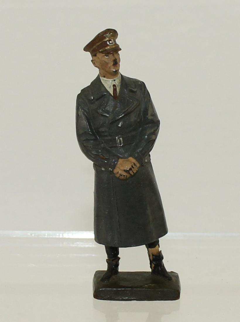 Lineol Hitler in Overcoat: Lineol Germany. #5/1. Circa 1939. Composition 7.5cm. 1 Piece. Condition Fair to Good. Broken at Ankles and Repaired with Wood Dowels. No Box.