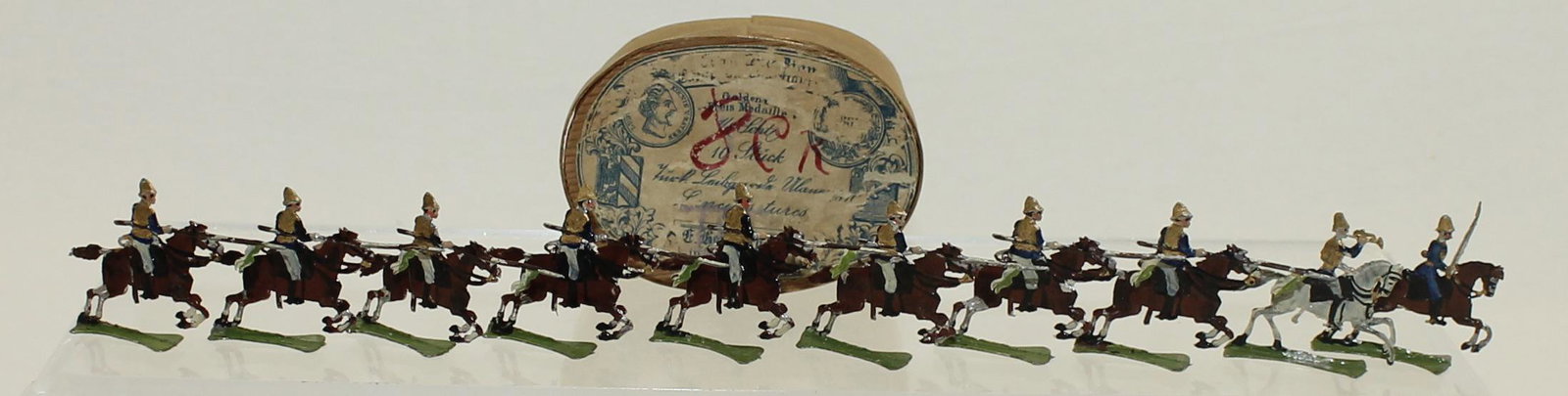 Heinrichsen Set Lancers Flats: Lancers in Tropical Dress. 30mm Flats. Circa 1900's. Original Box. 10 Pieces. Condition Very Good. Box Good.