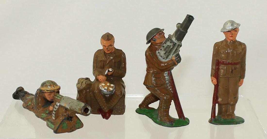 Manoil Barclay Lot British Troopers: Manoil and Barclay. Lot includes Manoil Man Lying Firing Machine Gun, Man Sitting Peeling Potatoes, Barclay Anti Aircraft and Barclay Man Standing at Attention. 4 Pieces. Condition Fair to Excellent.