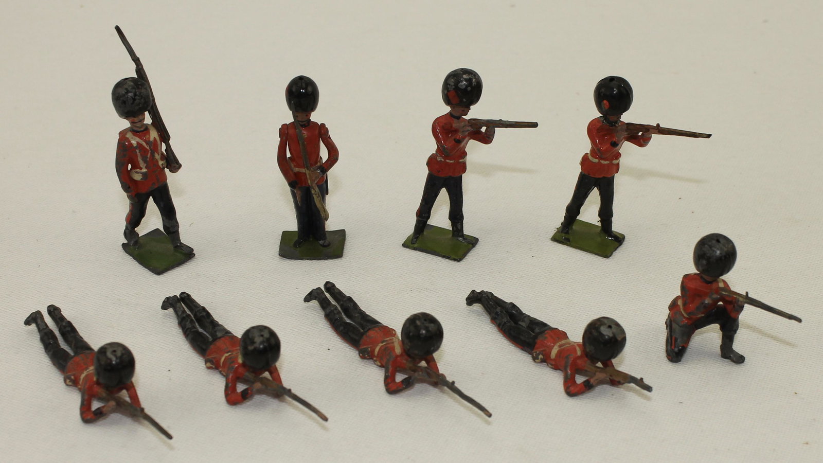 Britains Lot of Early Guards: Lot includes Irish Guards and 1/2 Boot Coldstream Guards. 9 Pieces. Condition Good. Two Rifle Barrels Damaged. No Box.