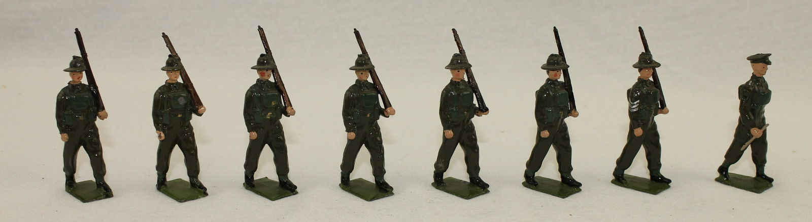 Britains Set 2031 Australian Infantry: In Battledress. 8 Pieces. Condition Excellent. One Figure Embellished with Chevrons on Sleeve. No Box.