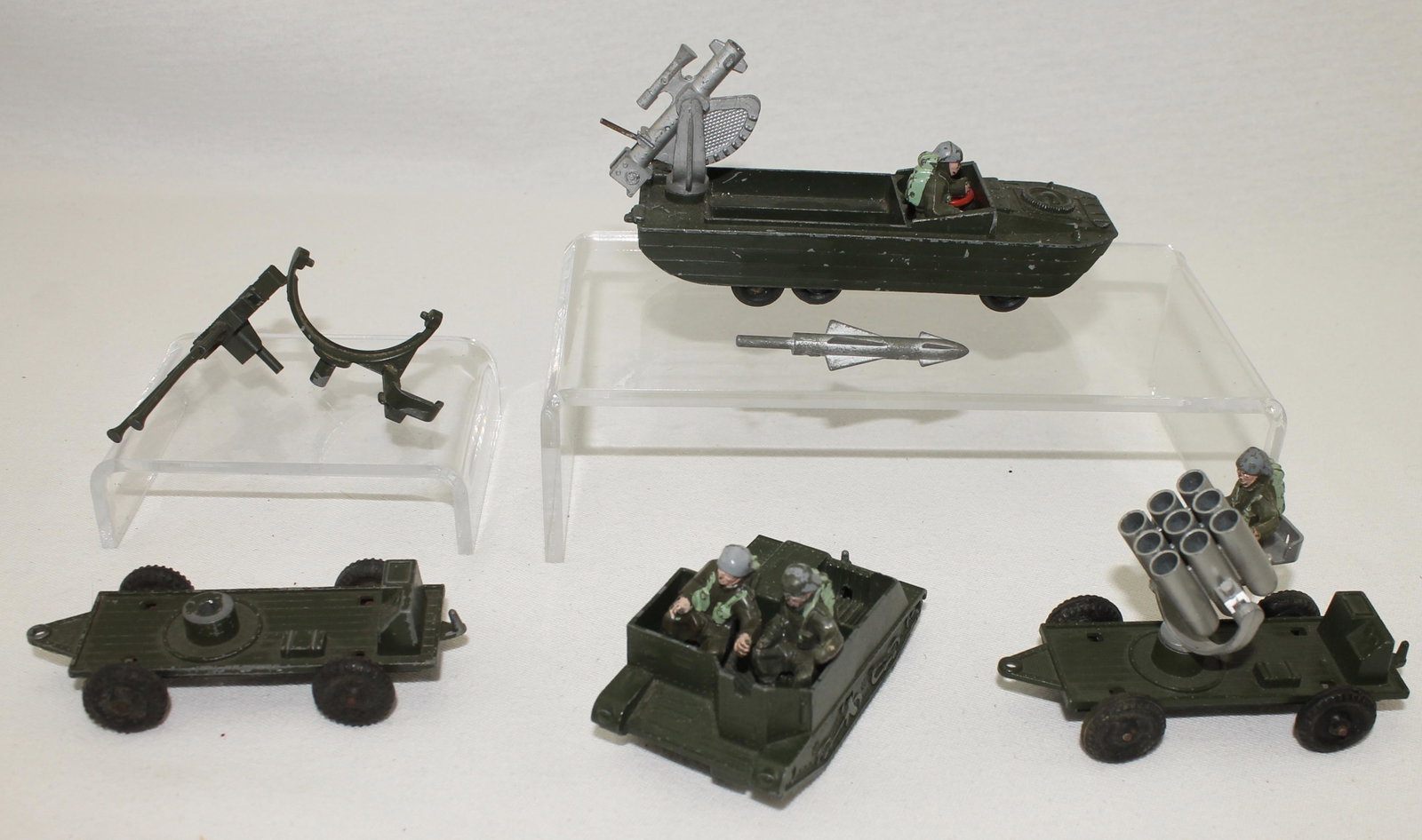 Lone Star Lot Die Cast Vehicles: Lot Includes Amphibious Craft with Driver, Missile Trailer with Operator, Bren Gun Carrier with 2 Crew and 3 Pieces of Misc. Equipment. 11 Pieces. Condition Good to Very Good. No Boxes.