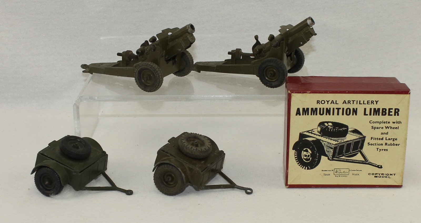 Britains Lot 4.5 Howitzer and Limber: Lot includes 2 Sets of # 1525 4.5" Howitzer and 2 Sets of # 1526 Ammunition Limber, (One Boxed). Pre-War. All Pieces have Rubber Tires. 4 Pieces. Condition Very Good. Box Very Good.
