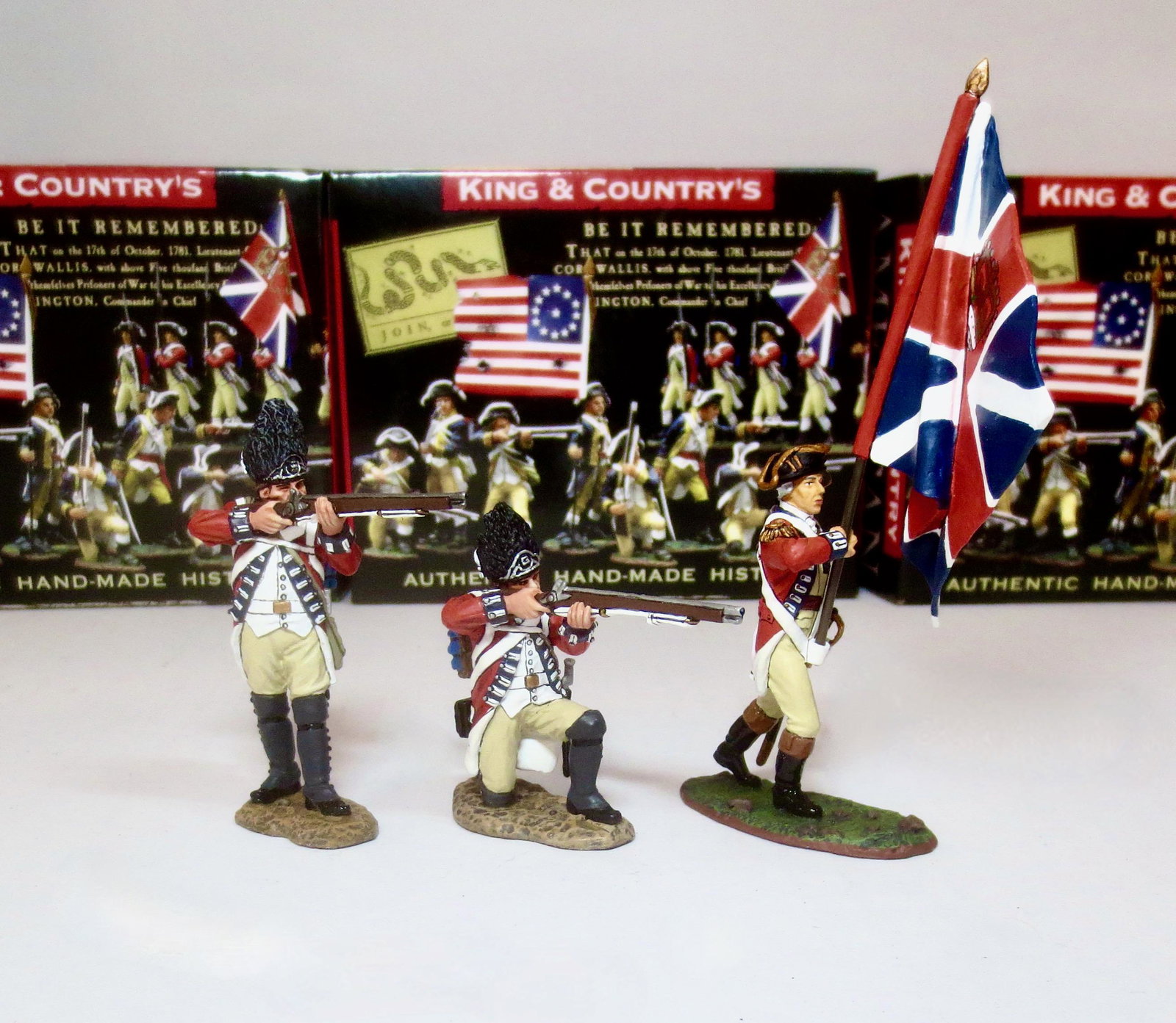 King & Country "American Revolution" Figures: Royal Welsh Fusiliers Standing Firing #BR079 and Kneeling Firing #BR080. Plus Marching Officer with Union Flag #BR035. All retired figures. 3 pieces. Mint condition. Boxes excellent.