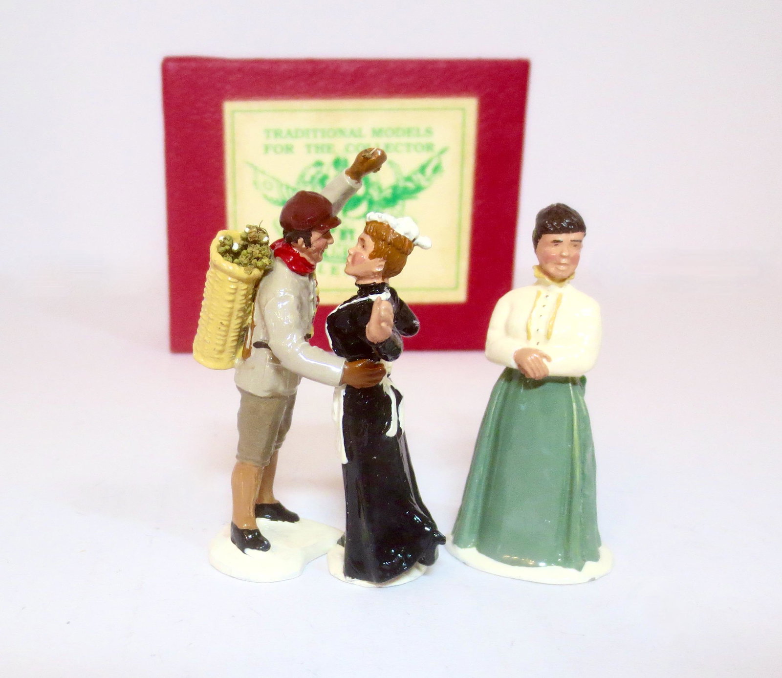 Trophy #XM18 "The Mistletoe Seller": From the Christmas series. 3 pieces. Near mint condition. Box excellent.