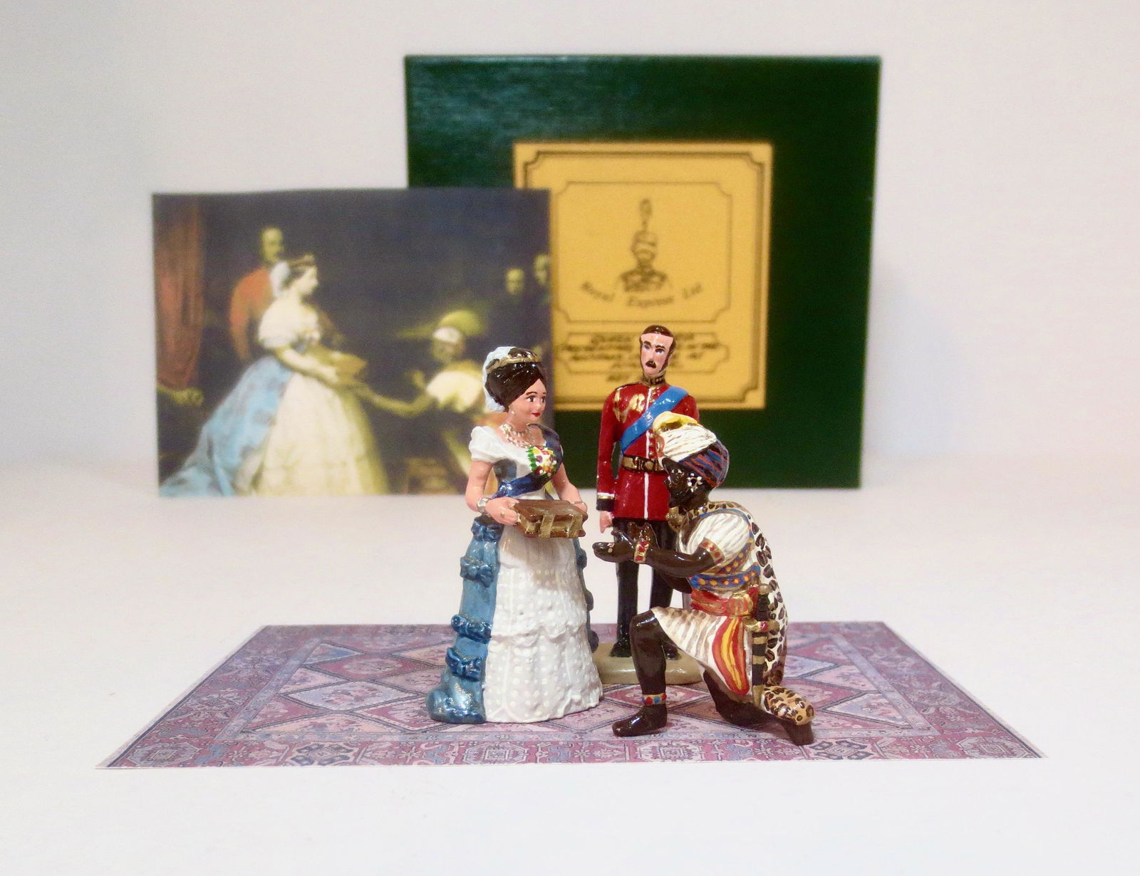 Royal Express Queen Victoria Presenting Bible: Based on the painting "The Secret of England's Greatness" by Thomas Jones Barker, depicting Queen Victoria meeting an African envoy and presenting him with a copy of the Bible. 4 pieces. Mint conditio