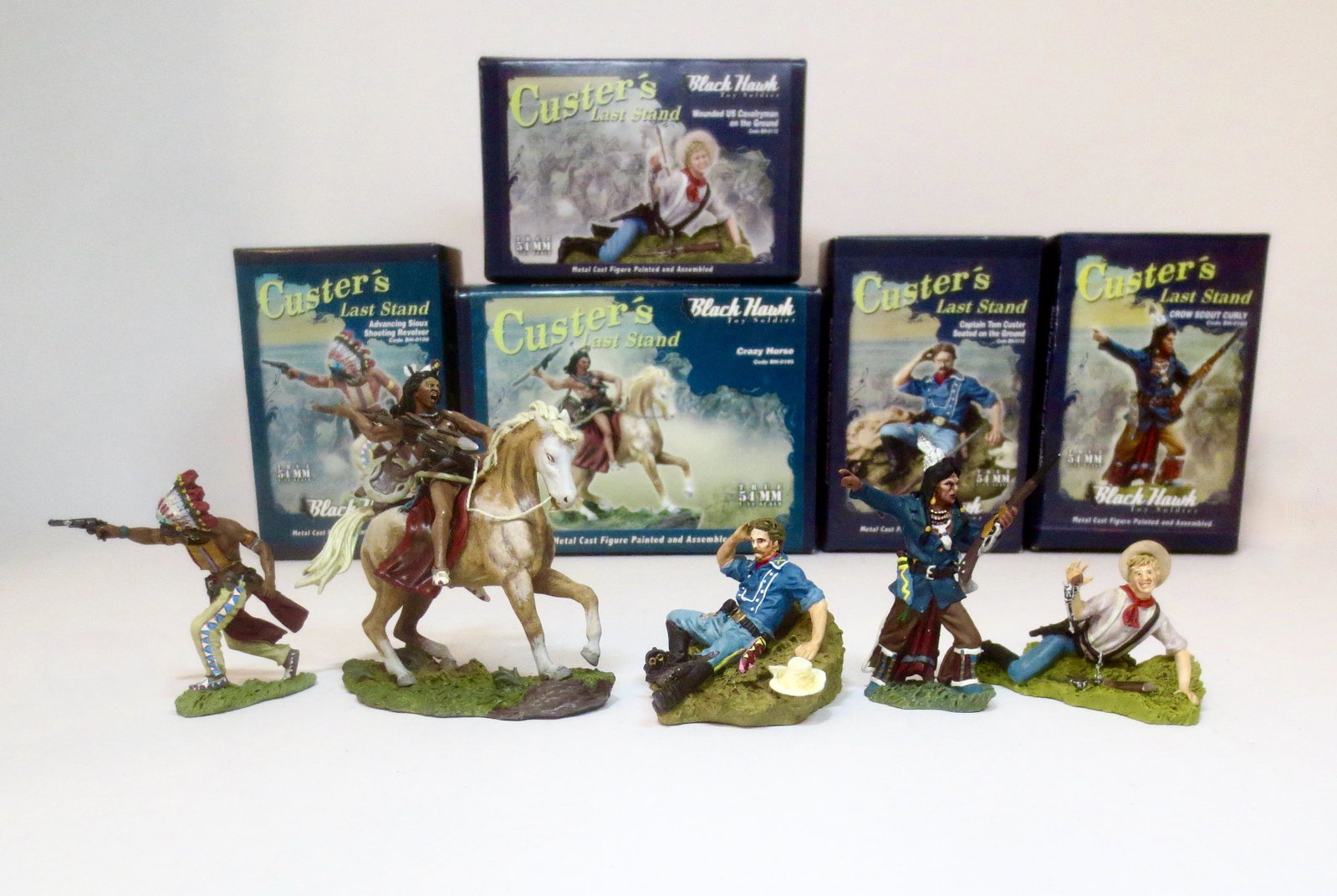 Black Hawk "Custer's Last Stand" Figures: Crazy Horse, Advancing Sioux Chief with revolver, Wounded US Cavalryman, Captain Tom Custer on the ground, Crow Scout Curly. 5 pieces. Mint condition. Boxes excellent.