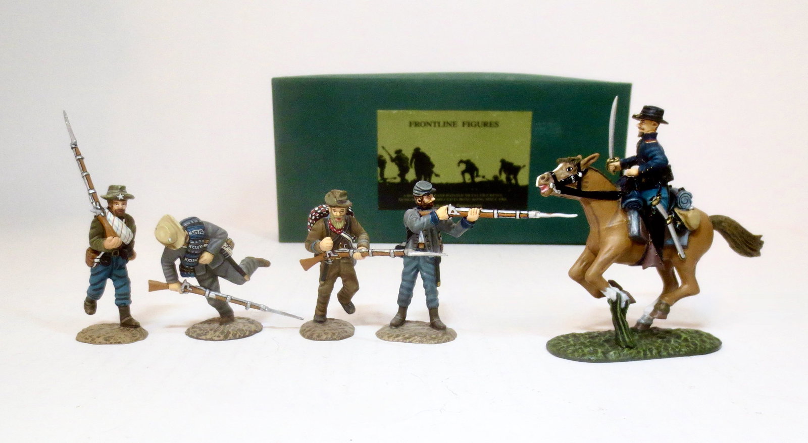 King & Country American Civil War Series: Union Artillery Mounted Officer #AUA4 (boxed), and four Confederate Infantry men (unboxed). Mint to near mint condition. Box excellent.