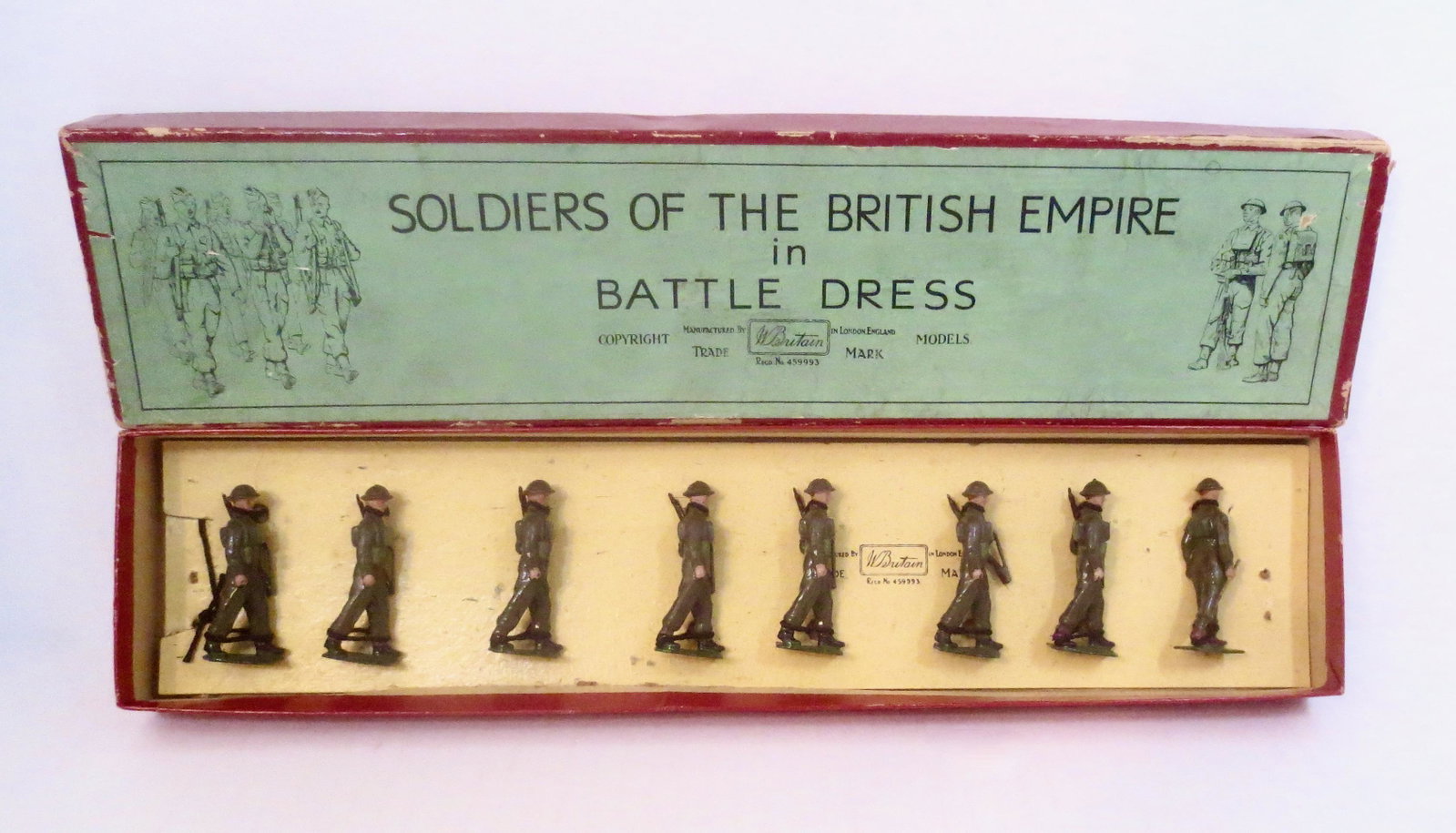 Britains #1858 British Infantry Full Battle Dress: Early post war issue. 8 pieces. Near mint condition, tied to card in "Soldiers of The British Empire" label box. Box fair (two top corner splits and one top side split).