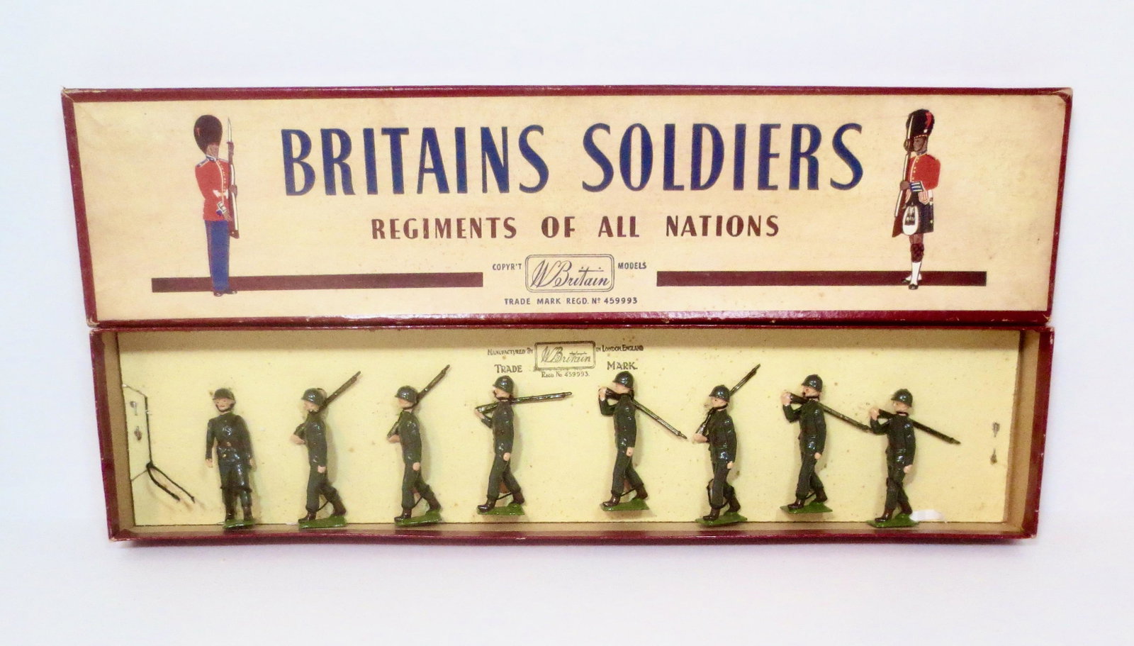 Britains #2033 United States Army Infantry: Service Dress, Steel Helmets. Post war issue. 8 pieces. Near mint condition, retied to card in box. ROAN box very good (one top corner split).