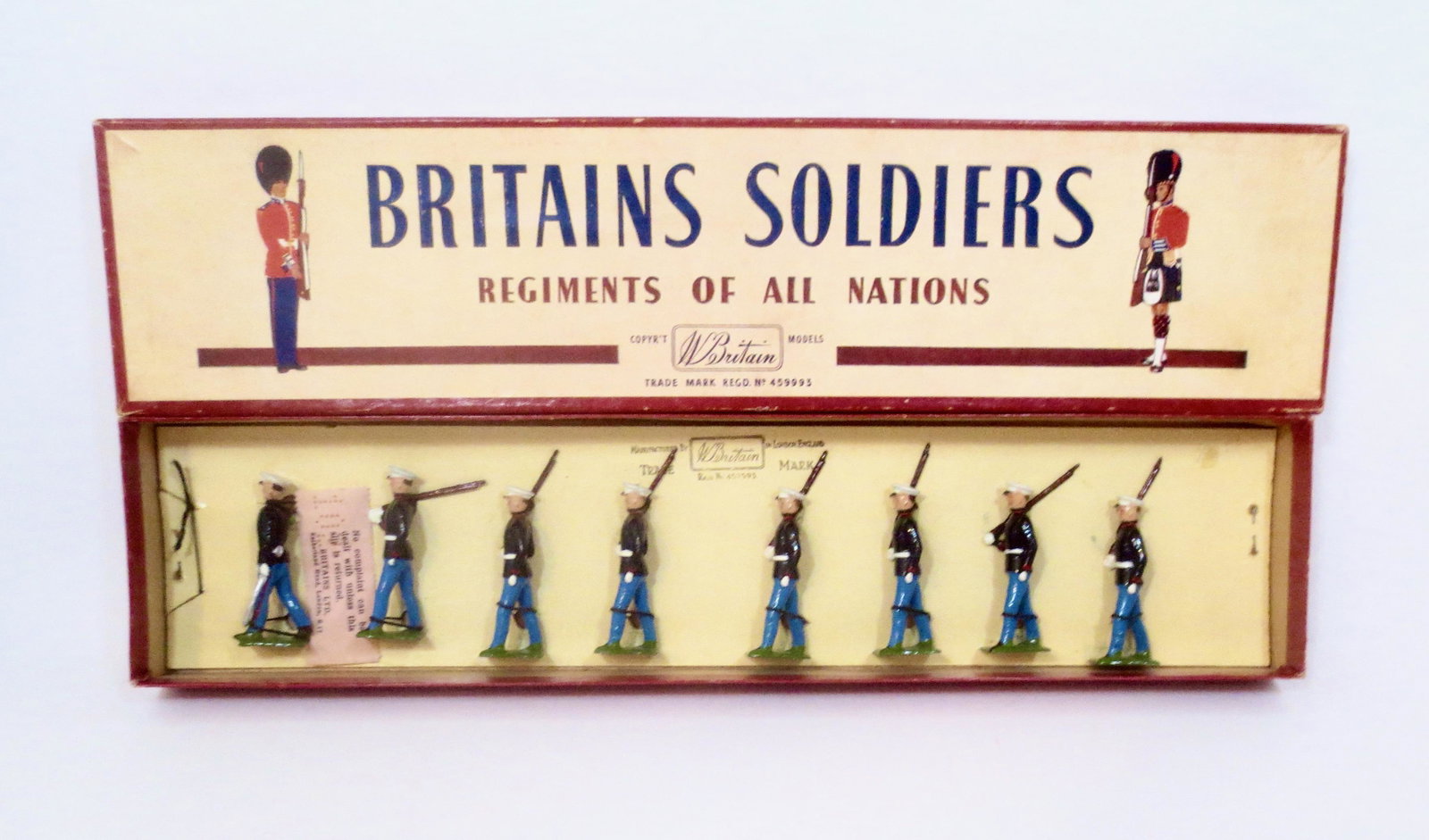 Britains #228 The U.S. Marine Corps: Blue Uniform with Officer. Post war issue, with ROAN box. 8 pieces. Mint condition, tied to card in box. Box excellent.