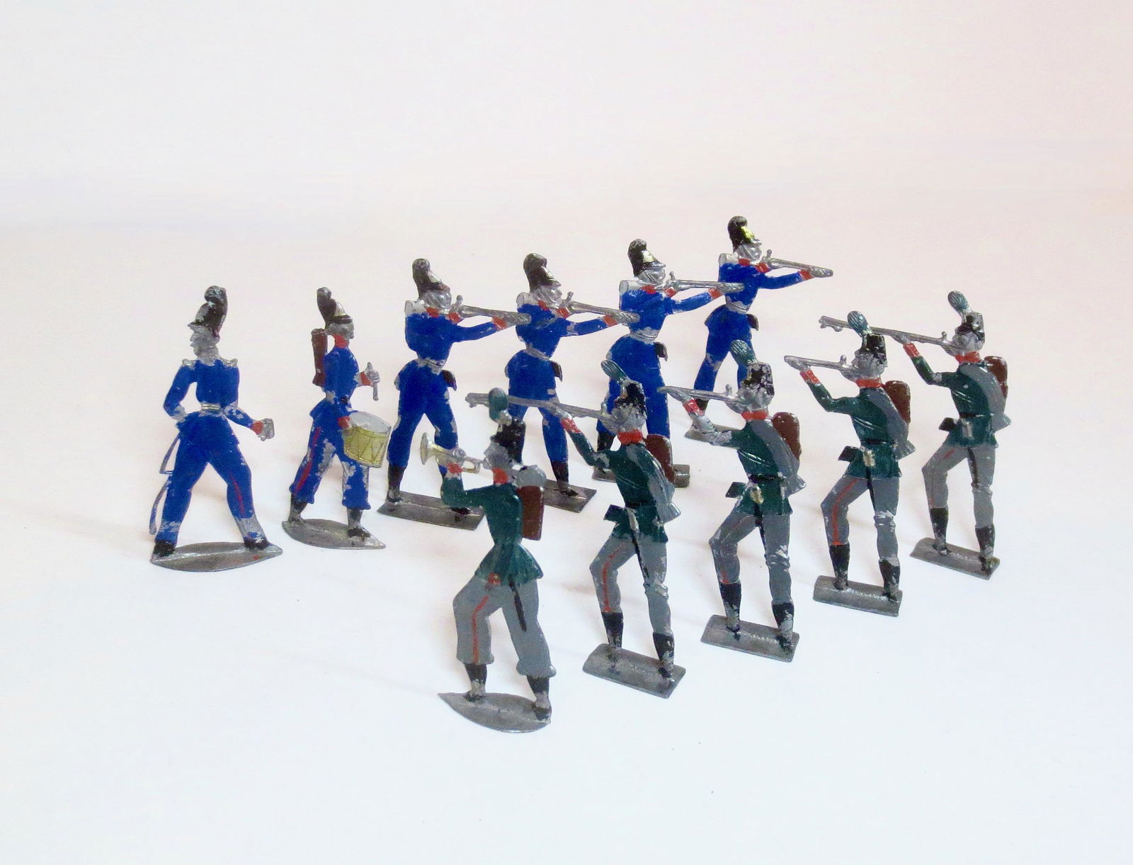 Large Scale 19th Century German Flats: Circa 1890. Franco Prussian War. 70mm tall. 11 pieces. Fair condition (one missing sword, 6 broken rifles). Unboxed.