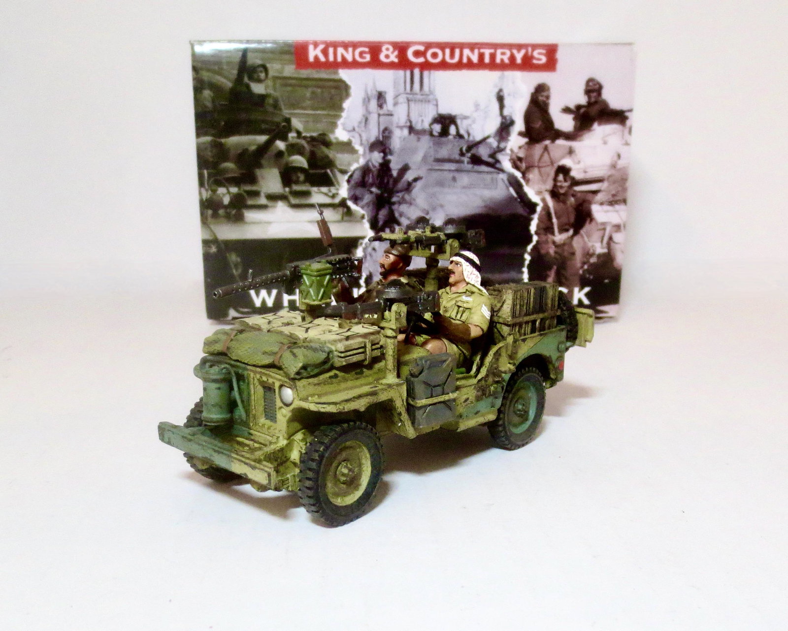 King & Country #EA115 "LRDG Attack Jeep": With heavy .50 caliber machine gun, a pair of Vickers .303 machine guns on the back, and two man crew. Retired set. Near mint condition. Box excellent.