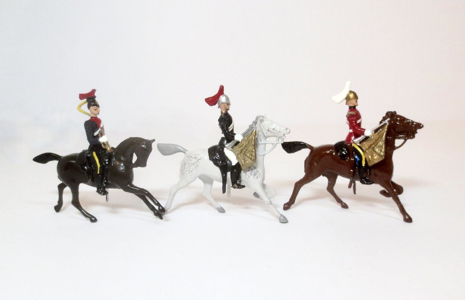 Britains What They Could Have Made: Royal Horse Guard Trumpeter on cantering horse, Dragoon trumpeter on cantering horse, and 12th Lancer bugler. 3 pieces. Excellent condition. Unboxed.