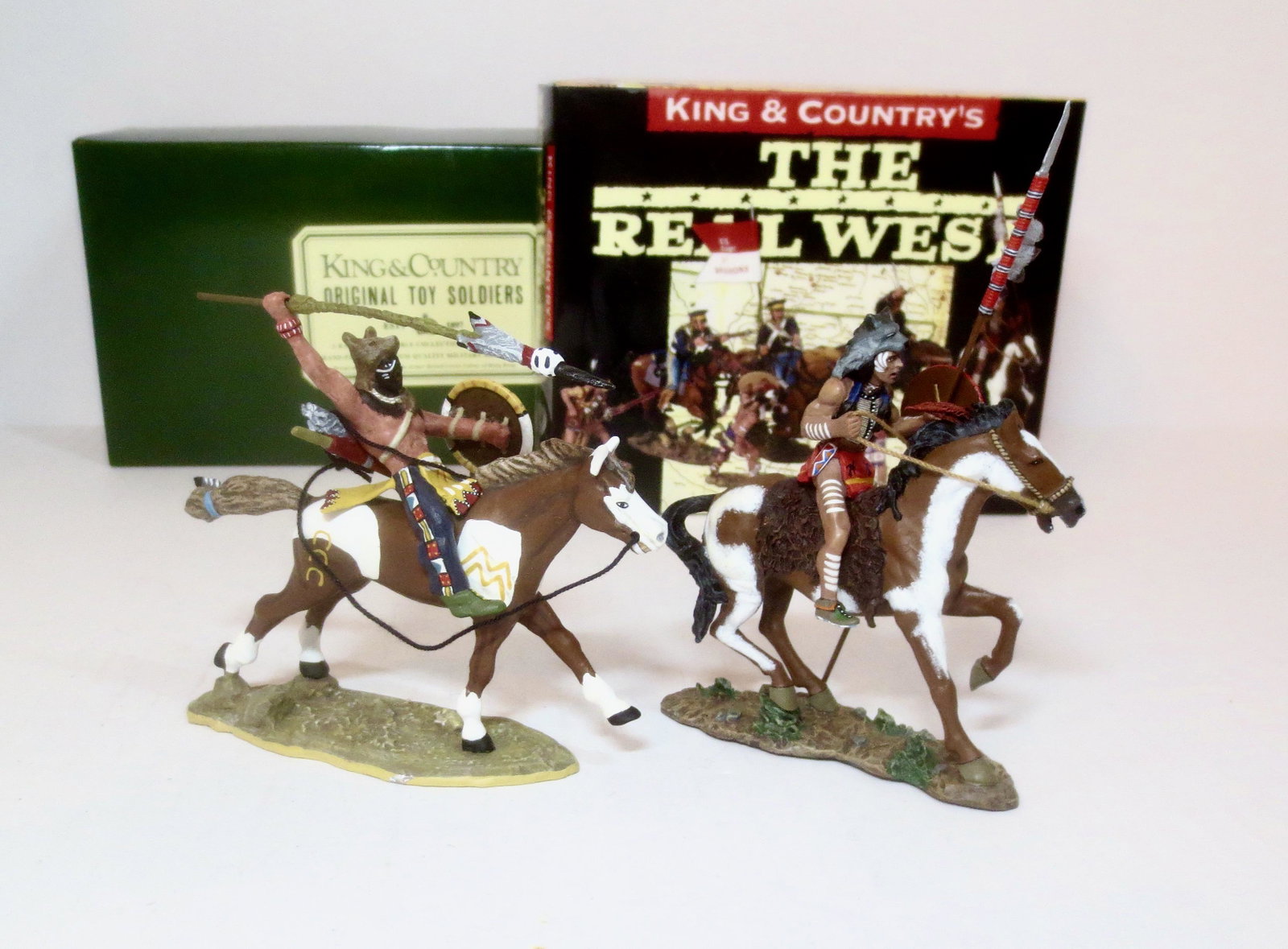 King & Country The Real West Series: Mounted Wolf's Head with Shield & Lance #TRW004, and Indian Warrior with Musket #TRW008. 2 pieces. Mint condition. Boxes excellent.