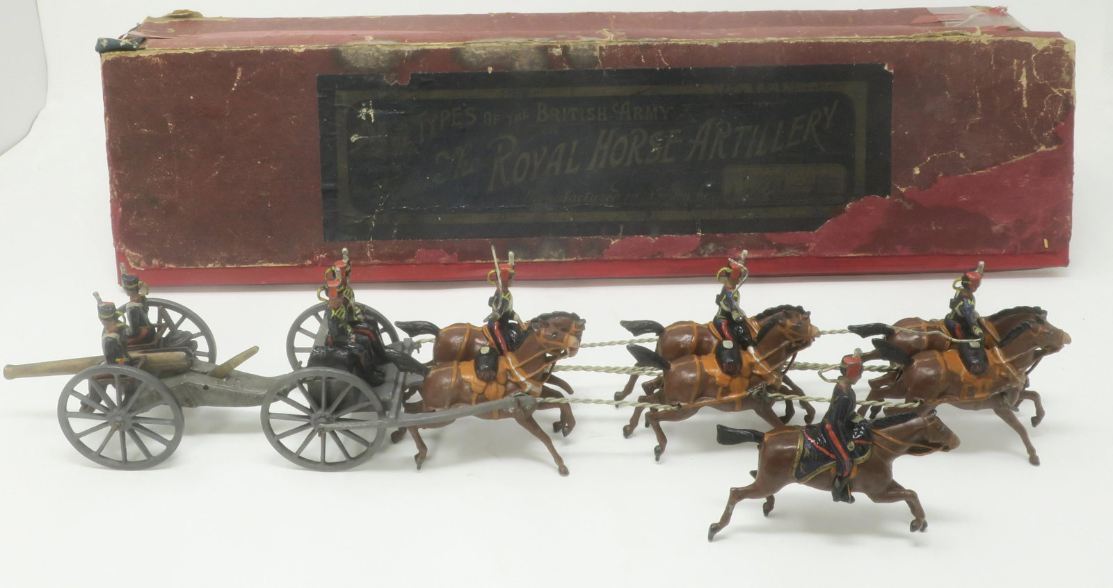 Britains Set #39 Royal Horse Artillery Gun Team: first version in original box with officer (1897) Exceptionally Rare, 1st version with seated gunners, superb early paintwork, Very good, I plume & one hoof gone; box fair-poor, lid repaired but with 