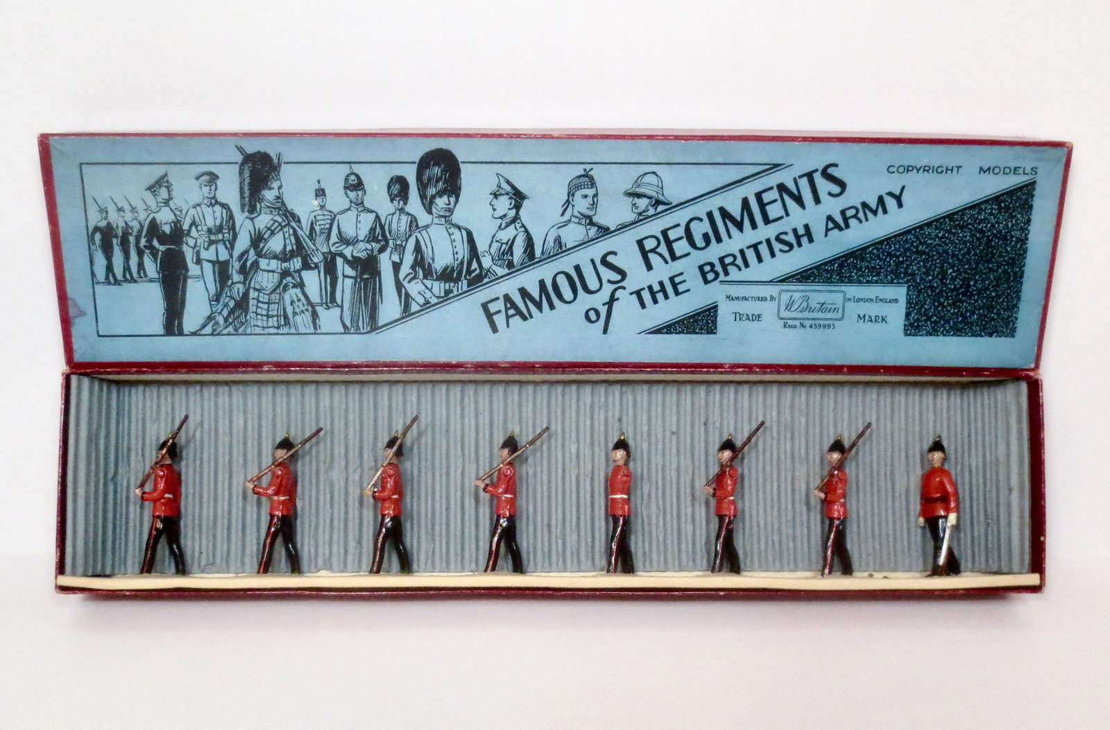 Britains #1577 RARE Royal West Kent Regiment: Circa 1937. Officer and Infantry marching slope arms. 8 pieces. Near mint to excellent condition (one missing arm). "Famous Regiments of the British Army" box excellent.