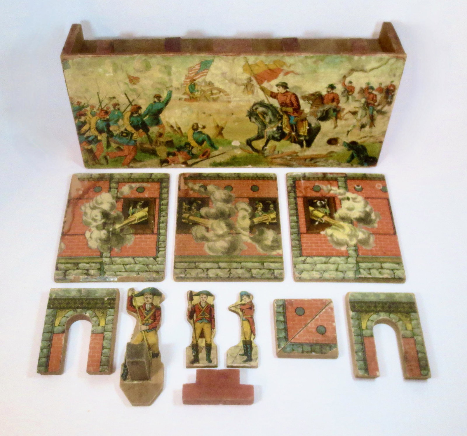 Turn of the Century Wooden Soldier Fort: Parker Brothers or similar maker. 11 pieces. Fort measures 18.25" long, 8" tall and 4" deep. Unboxed.