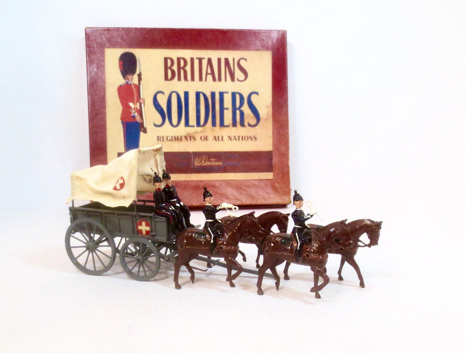 Britains #145 Royal Army Ambulance Wagon: Post war issue. 8 pieces (plus traces). Near mint to excellent condition. Box fair (missing tie card, faded top with stains).
