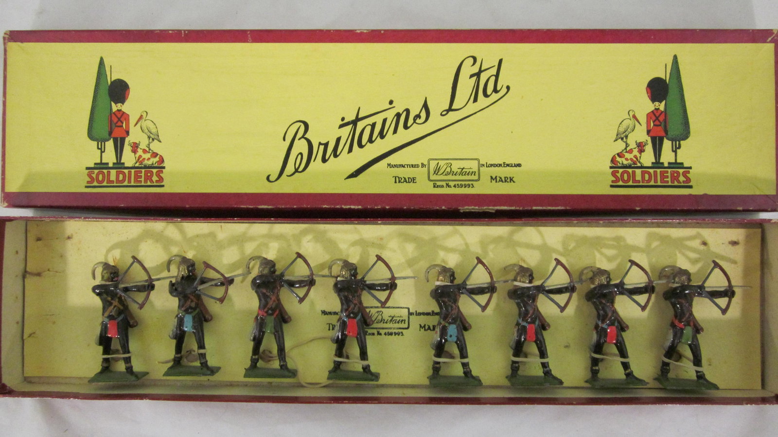 Britains Set #202 Togoland Warriors Attacking.: Boxed Togoland Warriors with Bows and Arrows. 8 pieces circa 1950s. Condition excellent in clean and excellent in yellow label "Stork and Tree" box.