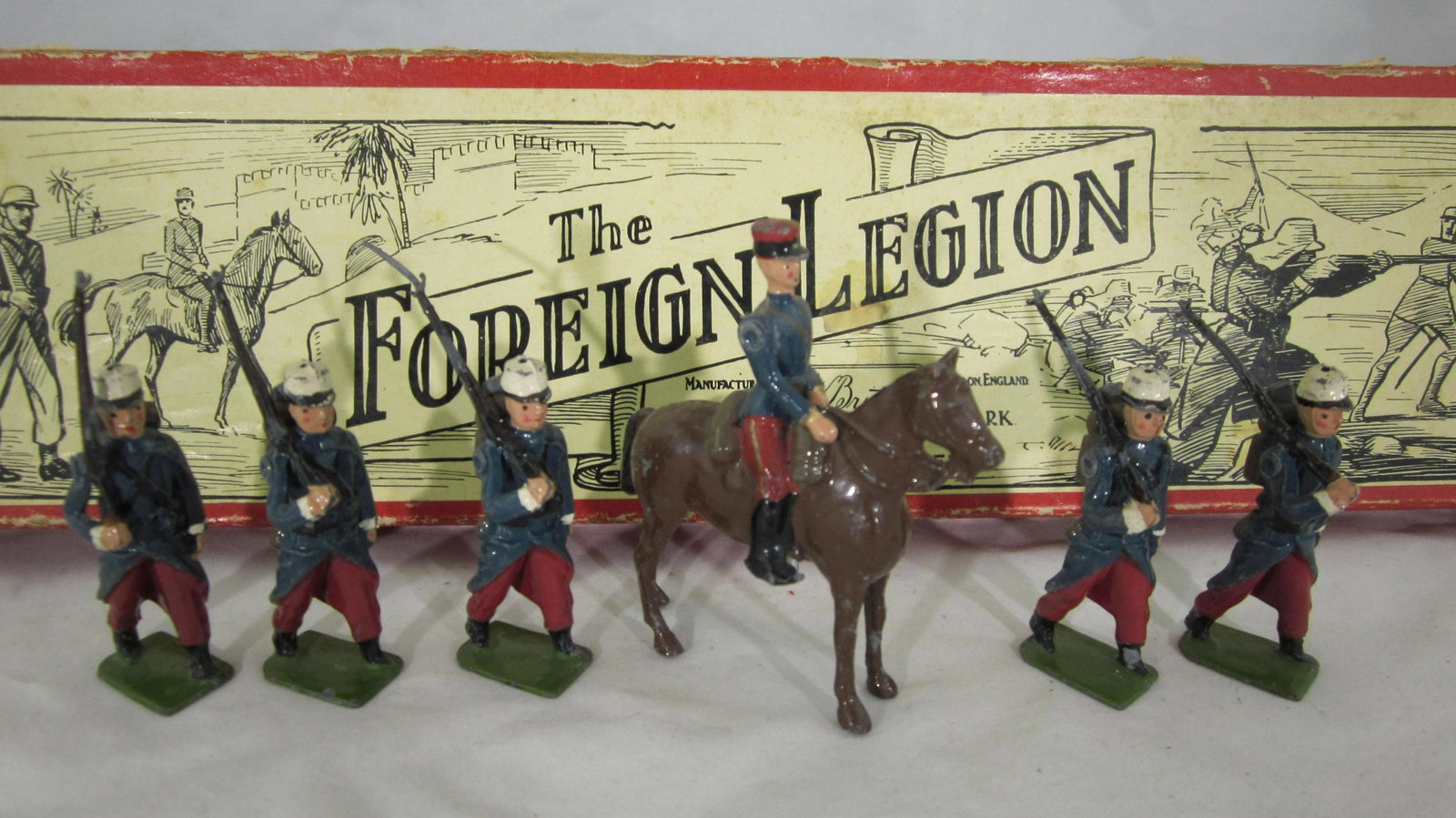 Britains Set #1711 French Foreign Legion.: Boxed French Foreign Legion with Officer at halt. 6 only, missing 1 trooper. Condition good, 4 bayonets missing, in good illustrated label box. Circa 1950s.