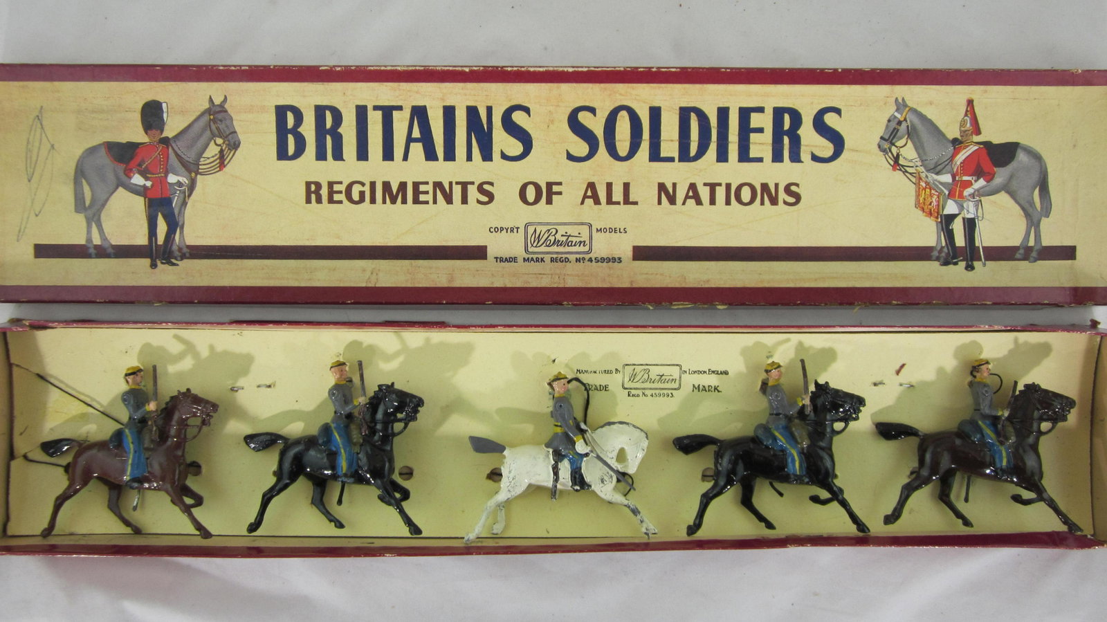 Britains Set #2055 Confederate Cavalry.: Boxed Confederate Cavalry, 5 pieces circa 1950s brushed dapple grey officer horse. Condition very good, 1 man rifle butt gone. Box is very good, lid has split on 1 side flap.