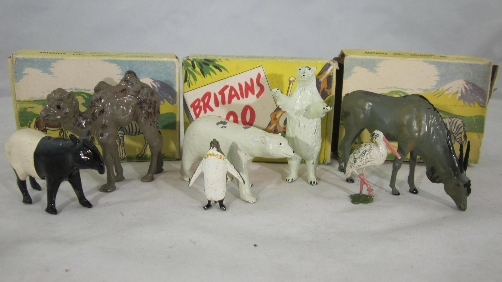 Britains Civilian Zoo Picture Packs Medley.: Boxed Zoo Packs #9006. 9007, 9009 containing stork, eland bull, polar bears, camel and more. 7 pieces. Condition excellent, 4 boxes are fair to good condition. Circa 1950s.