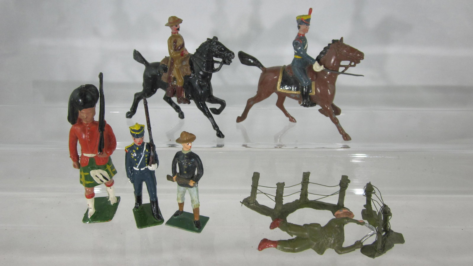 Britains Miscellaneous Foreign Troop Medley.: UNBOXED #216 Argentine Infantry, #217 Argentine Cavalry Officer, #105 Imperial Yeomanry (retouched), #91 U.S. Cuban War (rifle gone), large Crescent Highlander and man to cut wire. 8 pieces, condition