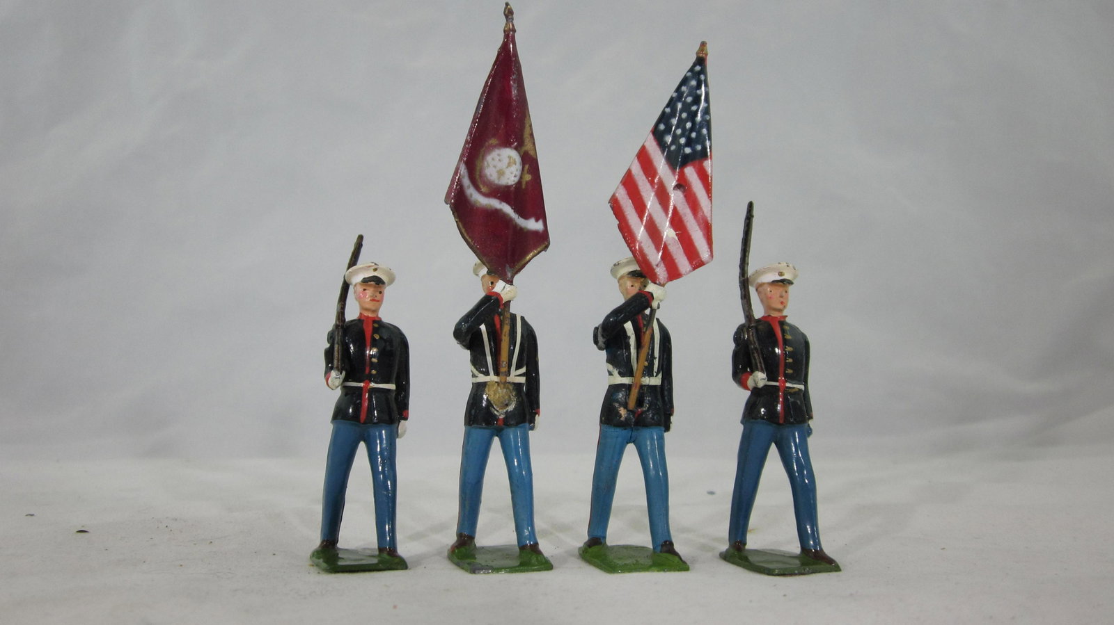 Britains Set #2101 U.S. Marine Color Party.: UNBOXED Marine Color Party, 4 piece set with red Regimental flag, brown shoes, only issued 1962-1963. Condition excellent. No box.