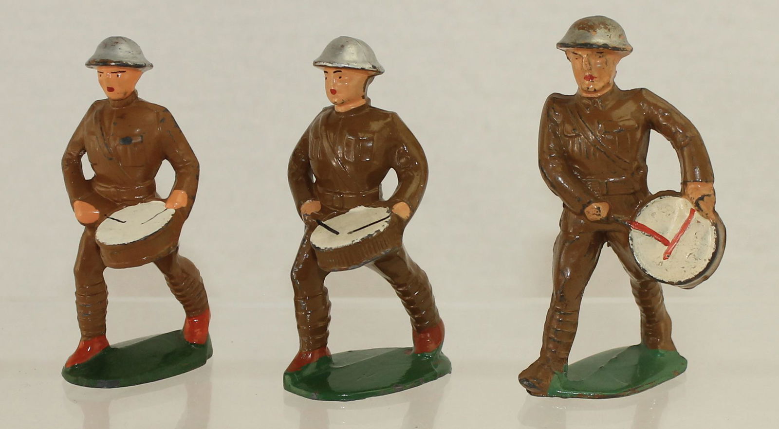 Manoil Lot Drummers: Manoil Dimestore. Lot includes M13 Hollow Base Version, M14 Stocky Version and M15 Vertical Drum. 3 Pieces. Condition Very Good. No Box.